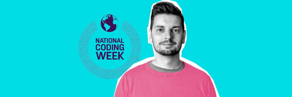 Atom bank's Tom Davies, stood wearing a pink shirt infront of a sign reading National Coding Week