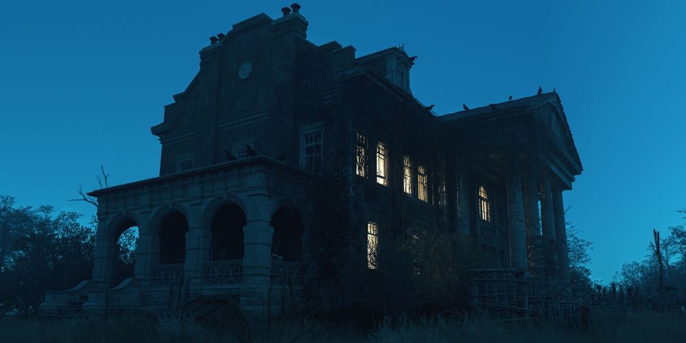 Haunted house on a hill at night