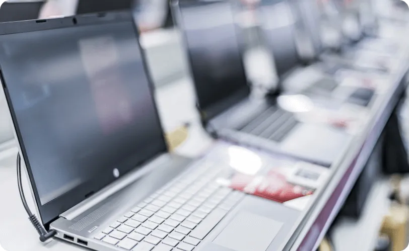 A row of laptops on display