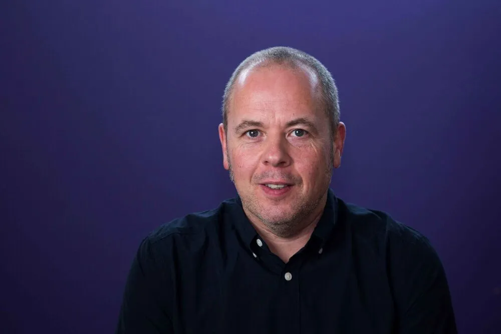 A headshot of Jon Holden