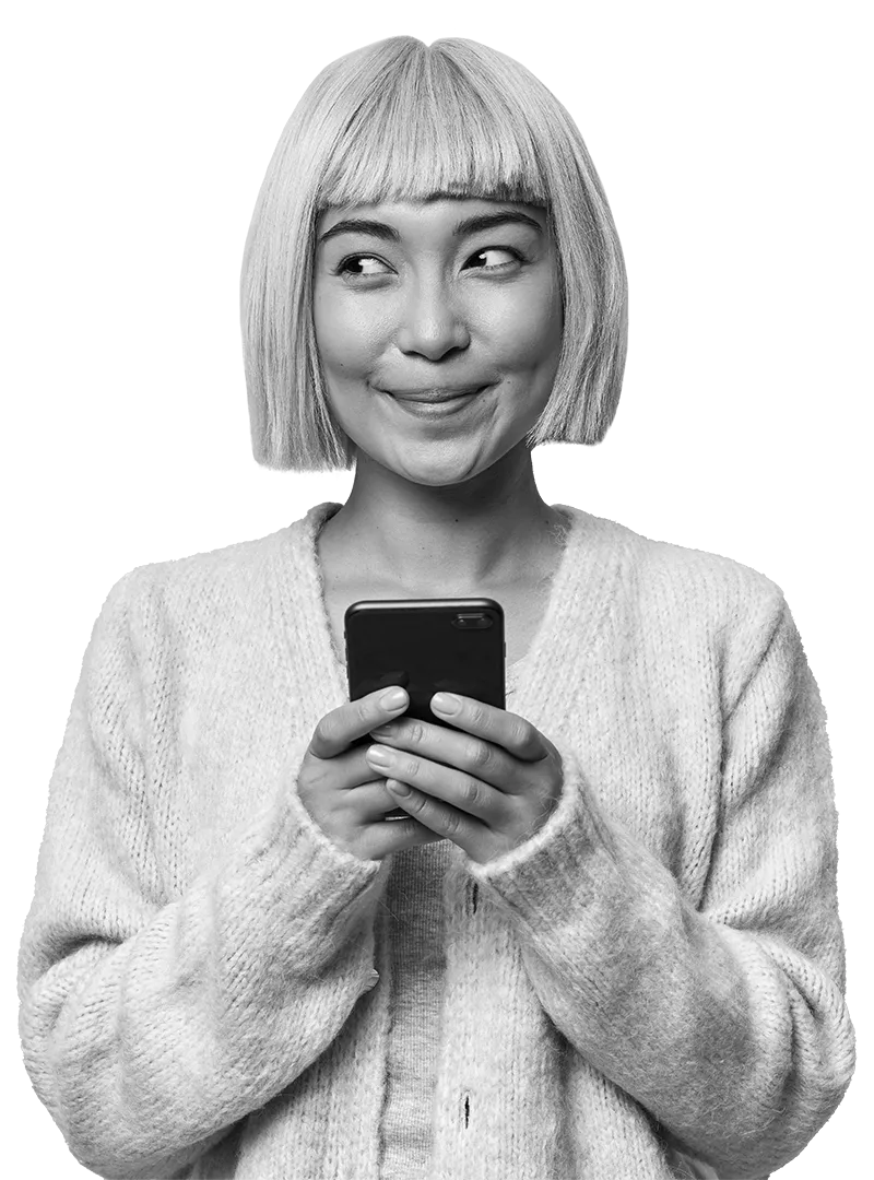 Person happily looks at phone, pointing their finger upwards