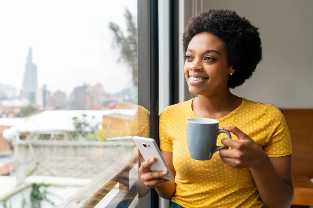 Person smiling through window