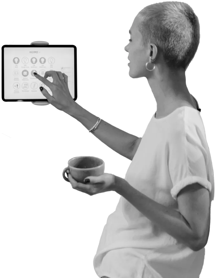 Person holding mug uses touchscreen, which shows a home page