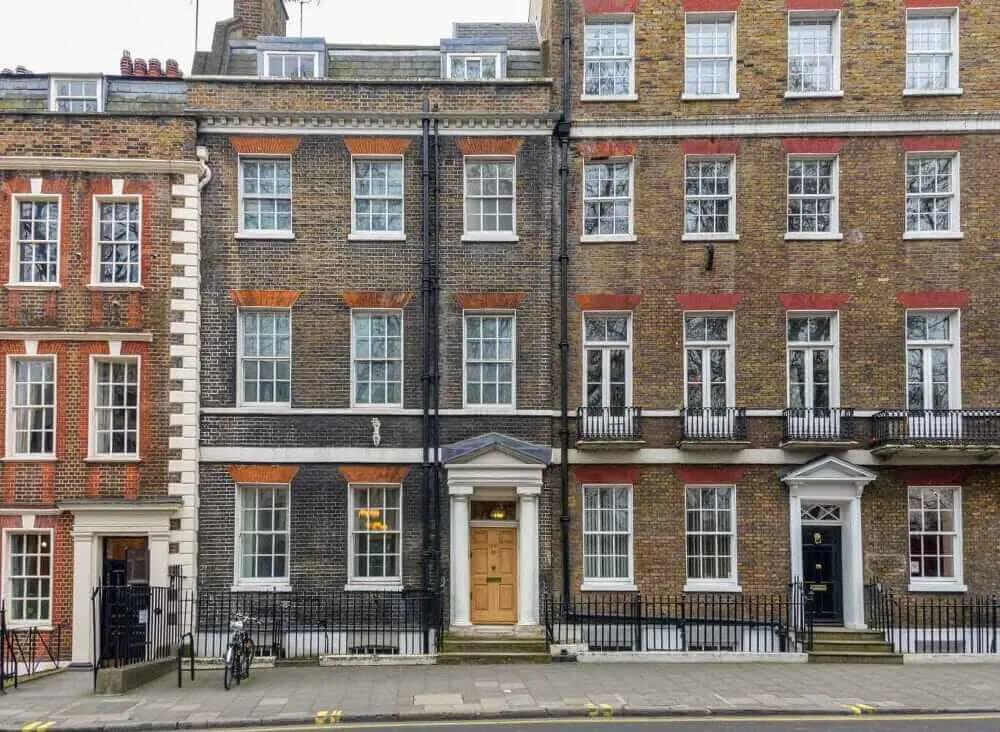 Terrace red and brown brick town houses in a city