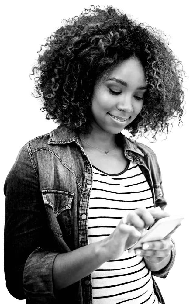 Young woman, in a stripey top, happily contacting Atom bank on her phone