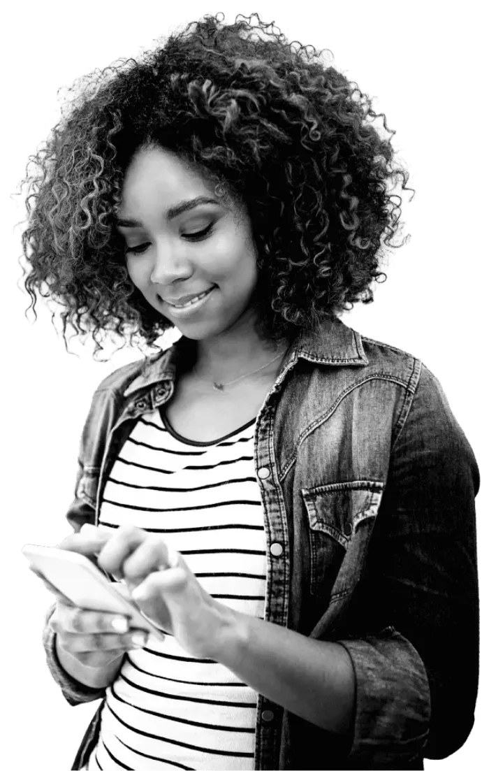 Young woman, in a stripey top, happily contacting Atom bank on her phone