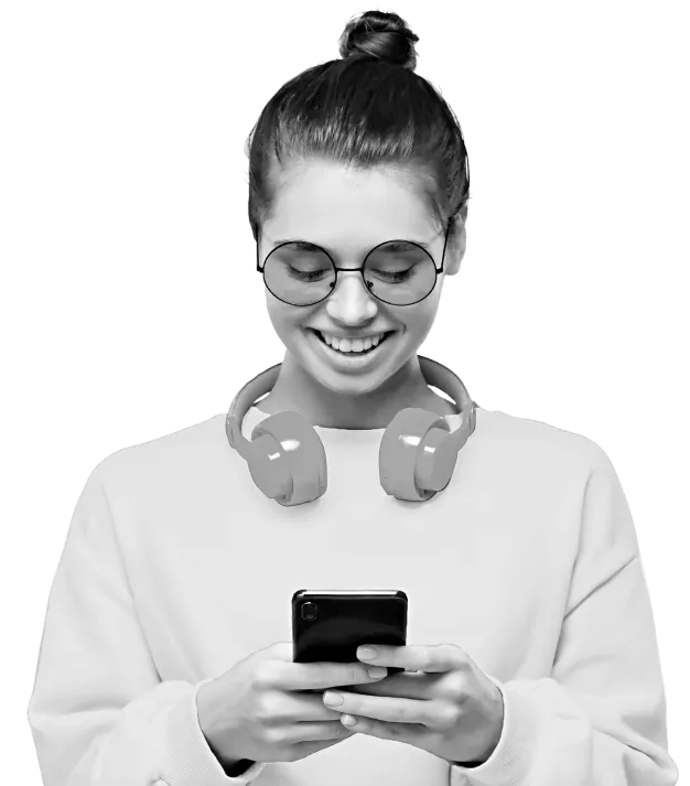 Woman on phone with headphones around neck