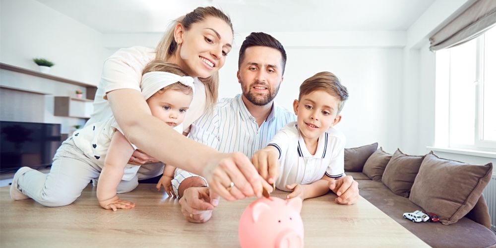 Young family saving money and budgeting